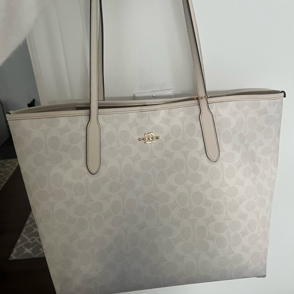Coach white signature canvas tote bag.